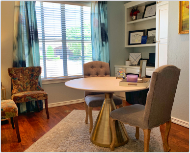 advances in dentistry reception area with table and chairs by window