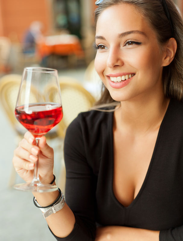 Woman holding a glass of red wine